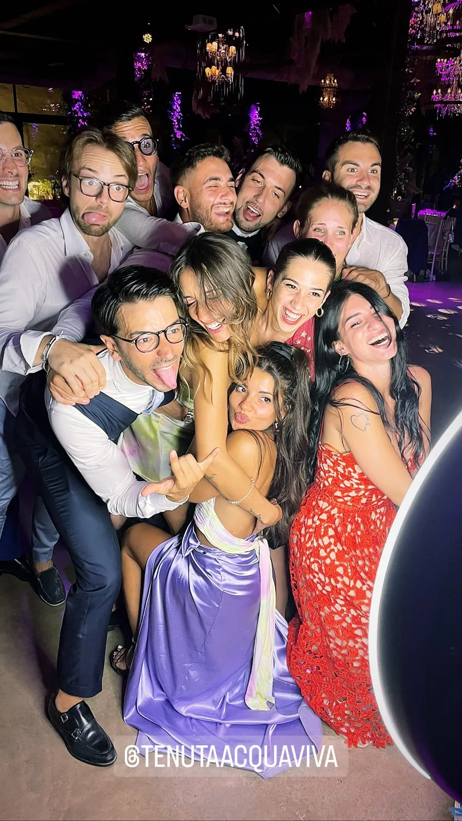 Photo booth at a wedding: guests and the couple