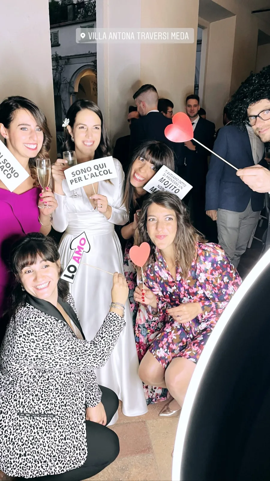 Photo booth at a wedding: guests and the couple