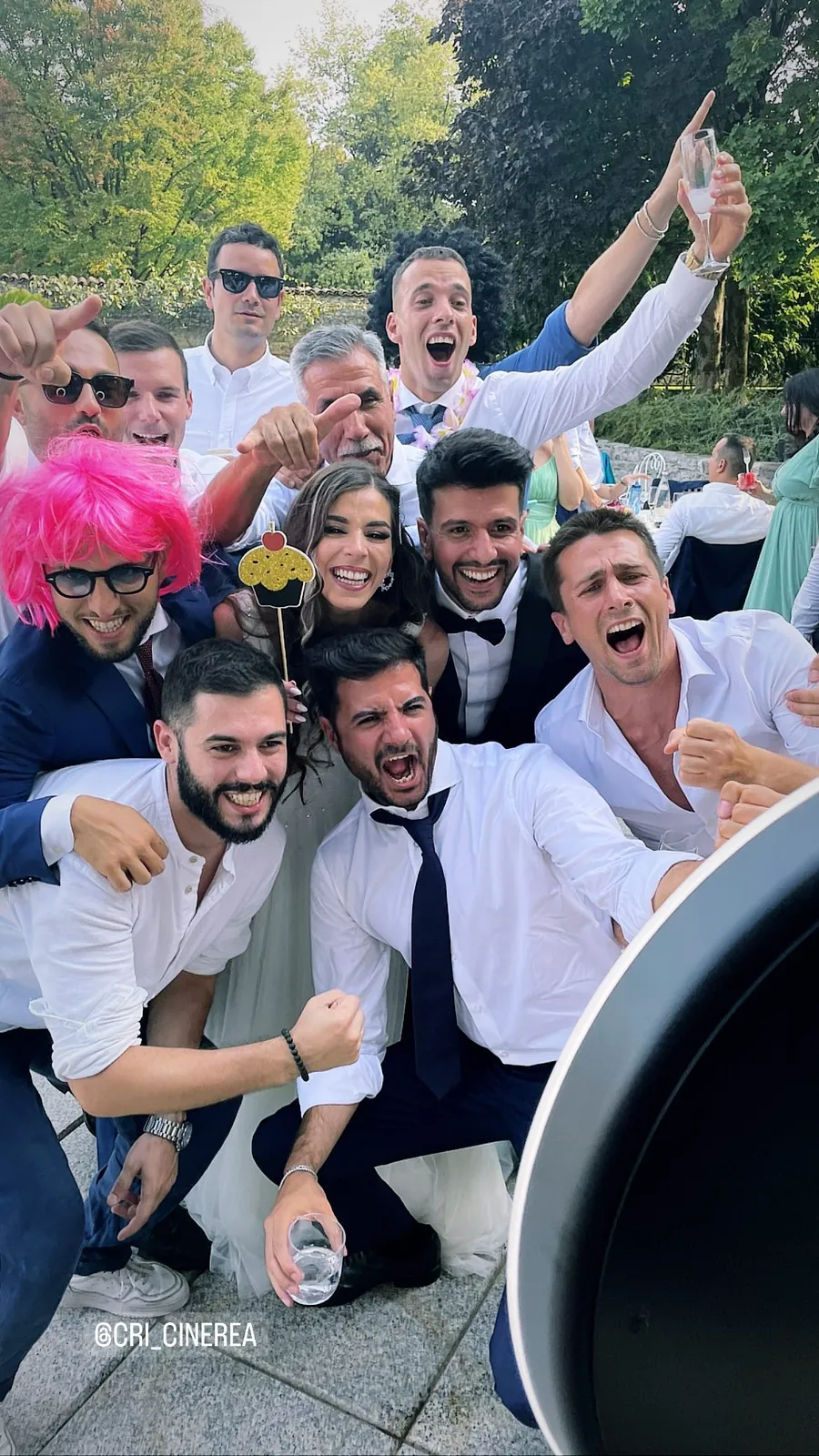 Photo booth at a wedding: guests and the couple