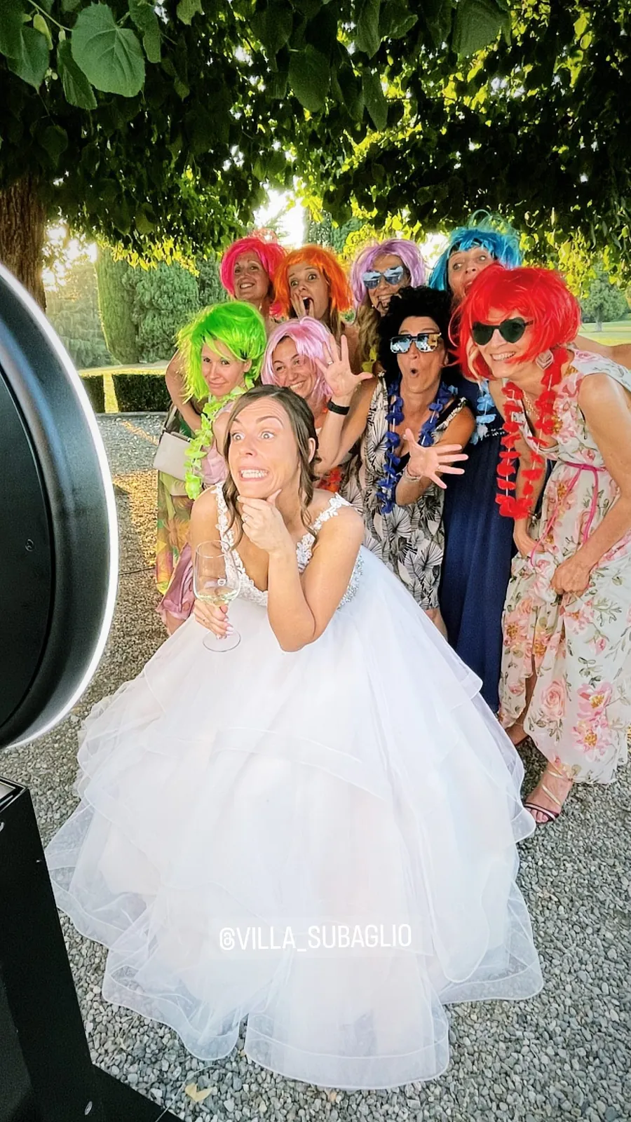 Bride and guests at the photo booth with props