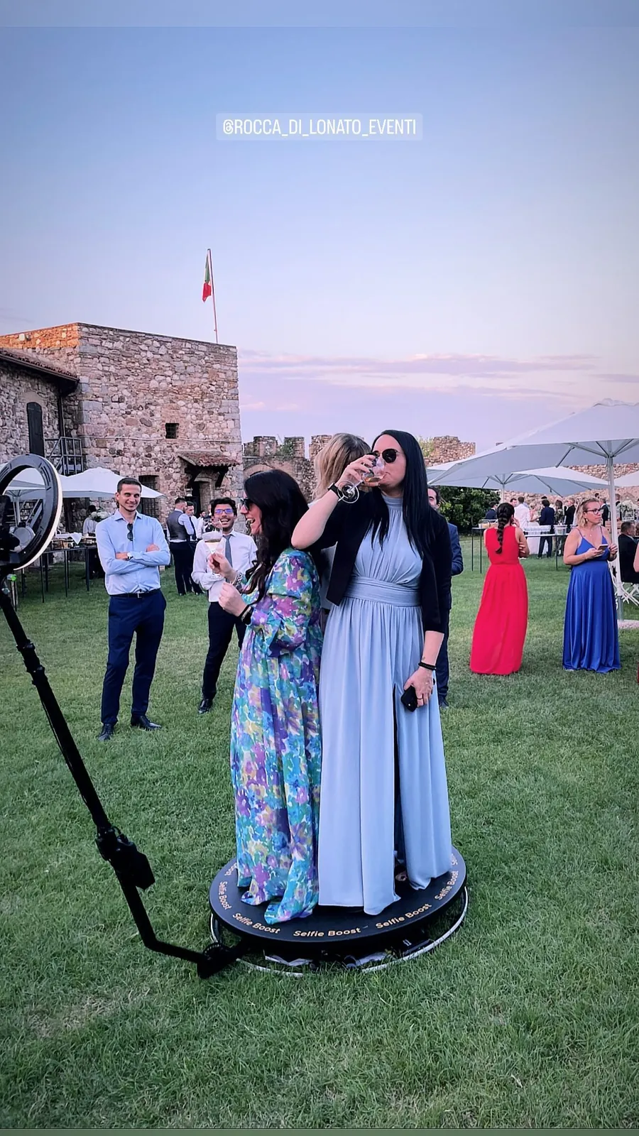 Photo booth at a wedding: guests and the couple